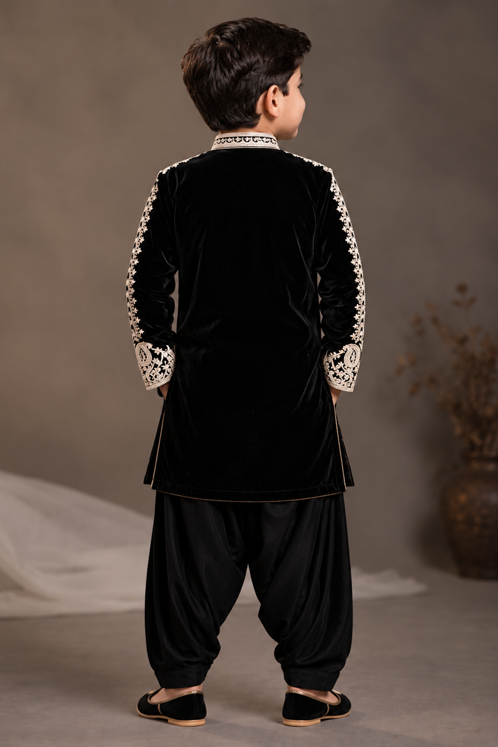 Black Velvet Kurta Set Featuring Inticate Golden Embroidery Paired With Classic Salwar