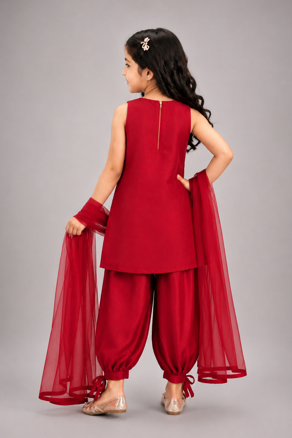 A Ruby Red Suit With Delicate Floral Embroidery And Paired With Tulip Pants