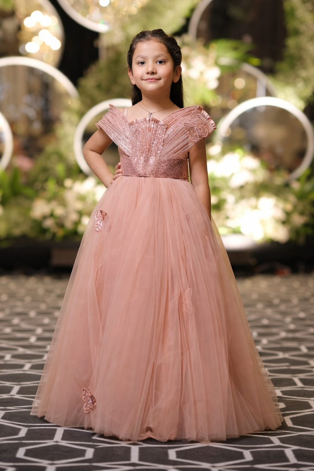 Gown with stuctured detailing and embellished butterflies