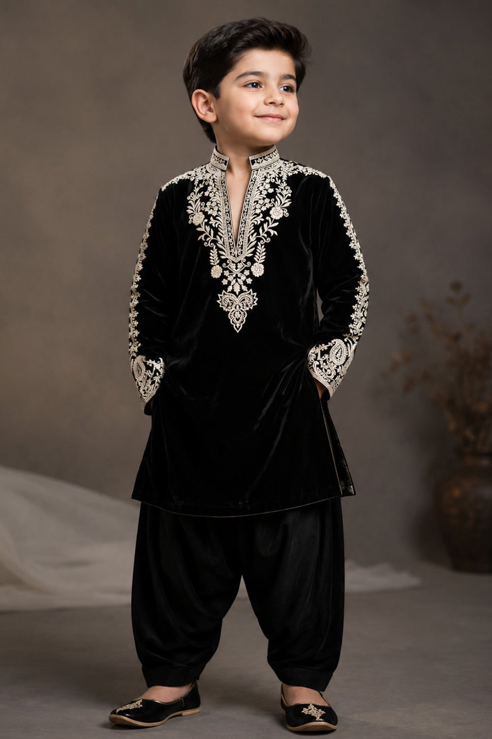 Black  Velvet Kurta  Set Featuring Inticate Golden Embroidery Paired With Classic Salwar