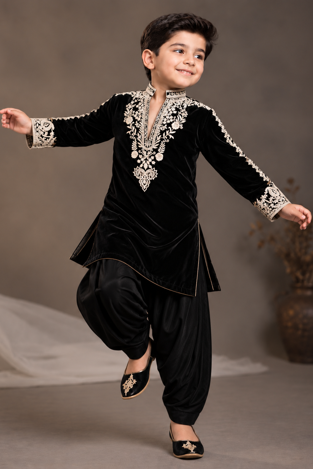Black  Velvet Kurta  Set Featuring Inticate Golden Embroidery Paired With Classic Salwar