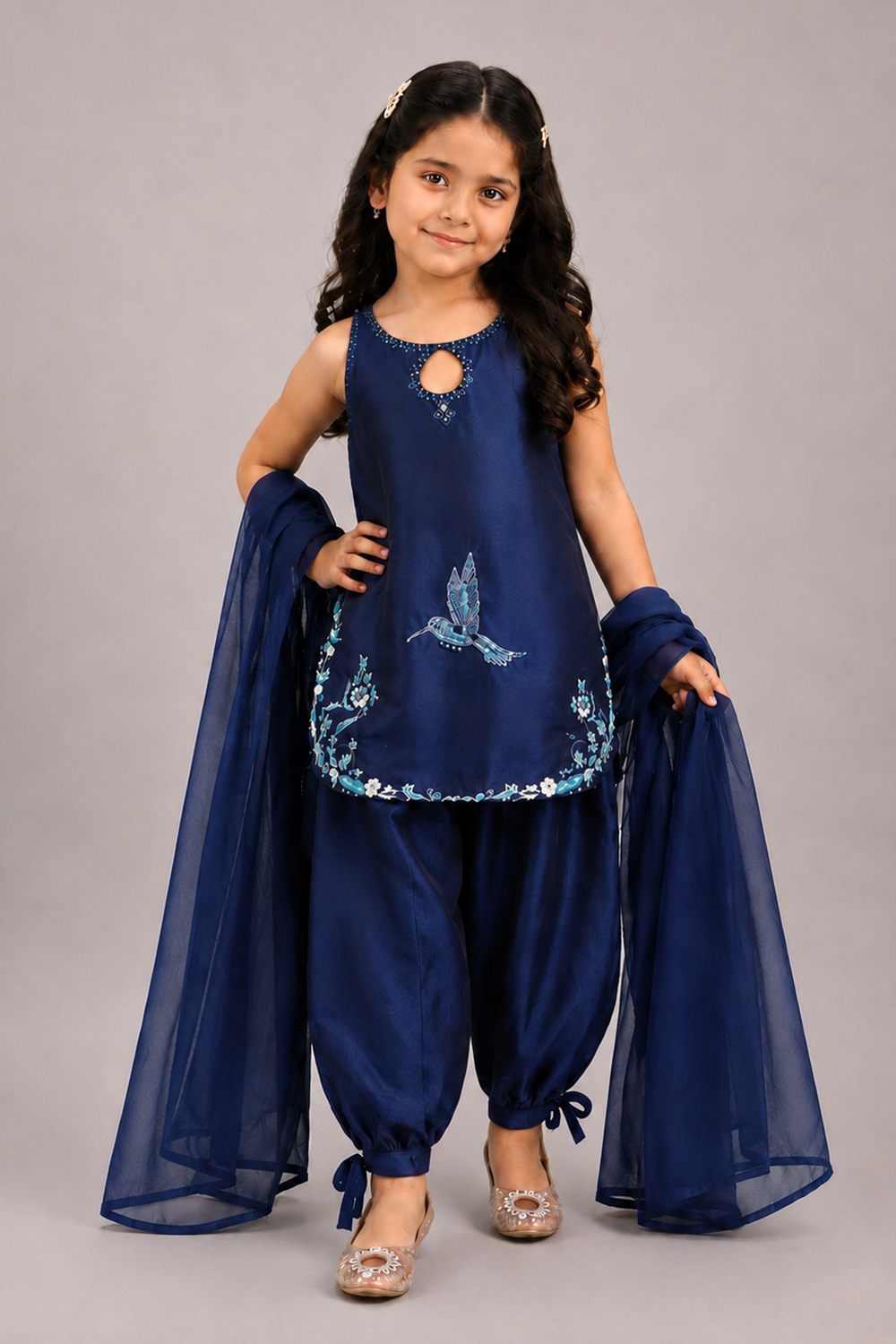 A Navy Blue Suit With Delicate Floral Embroidery And Paired With Tulip Pants