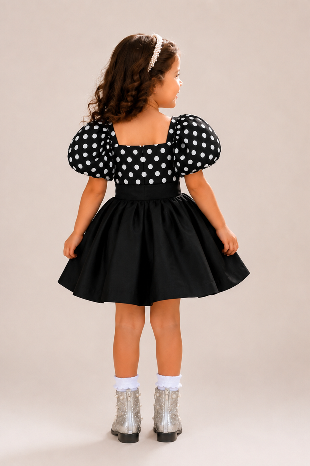 Black Polka Dot Top Paired With A Matching Flared Skirt